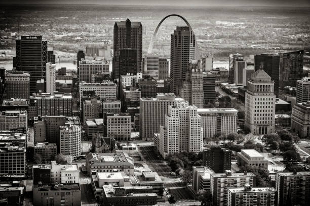 An aerial view of the St. Louis, Missouri metropolitan area shot from the Illinois side of the Mississippi River from an altitude of about 1000 feet and toned in black and white for a retro type style.