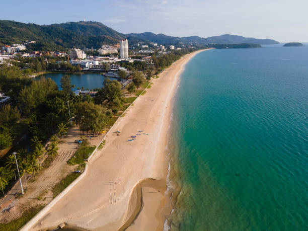 istock Aerial view beach and city in sunset 1303954002