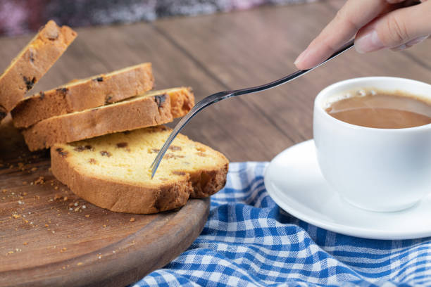 istock Sliced sultana pie served with a cup of coffee 1303956002