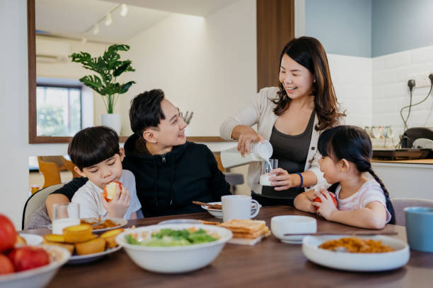 istock Asian Chinese family having breakfast in kitchen 1303958380