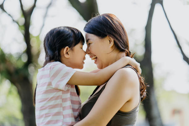istock Asian mother and daughter bonding time at outdoor park 1303959310