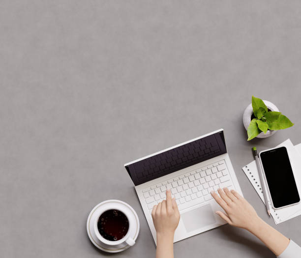 istock Overhead shot of office desktop. Person using a laptop computer. Top view with copy space, flat lay. 3d illustration. Render. 1303960209