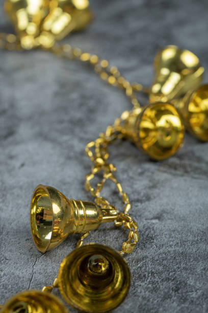 istock Christmas golden bells on marble background 1303960264