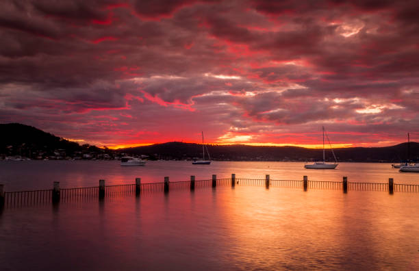 istock Beautiful red sunset at Yattalunga Australia 1303961223