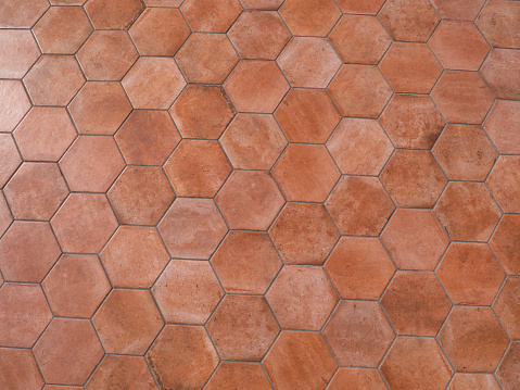 Terracotta background material. Honeycomb type red brick tile.