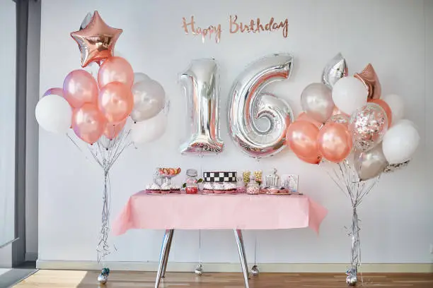 Photo of Candy bar and balloons, number 16 from balloons for birthday celebrations