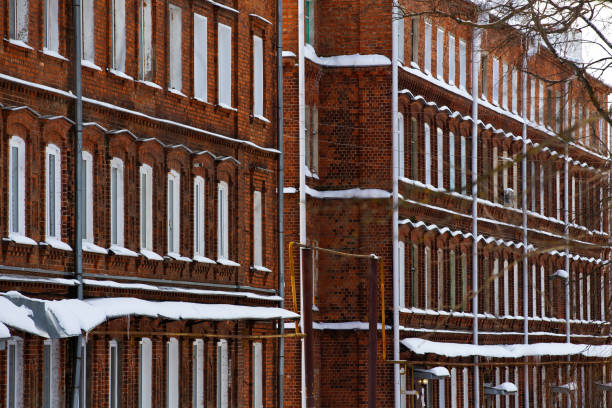 istock brick building facade in red and white colors, background, texture 1303965435