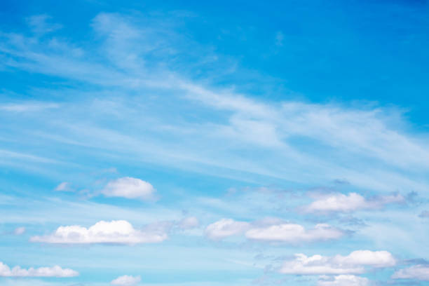 istock Gentle blue sky with white beautiful cirrus clouds, natural heavenly abstract background with good weather 1303967099