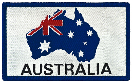 Vintage Australian national flag stars design badge tag, isolated embroidered rectangular Australia souvenir sew-on clothing label union jack star blazer patch, large detailed horizontal macro closeup, authentic original blue, white, red colors, woven rectangle commonwealth country constellation emblem