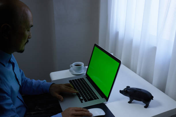 The computer screen is green so that chroma keying can be performed.