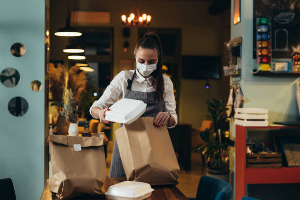istock waitress working in restaurant of cafe 1303974196