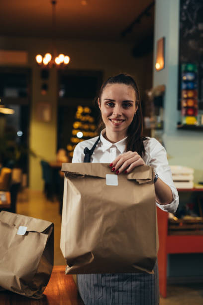 istock waitress working in restaurant of cafe 1303974399