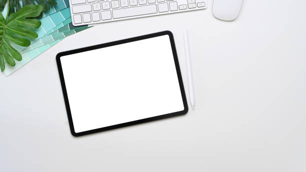 istock Mock up digital tablet with blank screen, keyboard, color swatches and copy space on white background. 1303975232