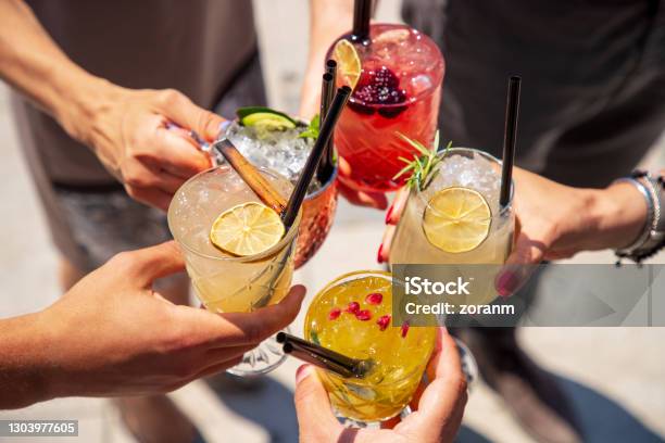 Five Cocktails In Hands Joined In Celebratory Toast Stock Photo - Download Image Now