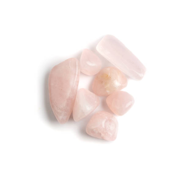 istock Rose quartz pebbles isolated, pink quartz polished stones 1303979220