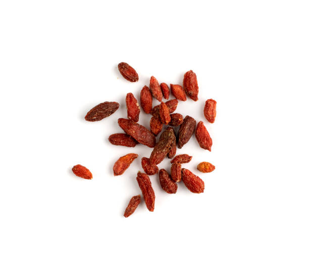 Dried barberry isolated, goji berries, dehydrated wolfberry Dried barberry isolated. Dry goji berries on white background, dehydrated wolfberry top view wolfberry stock pictures, royalty-free photos & images