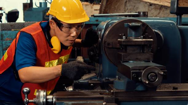 istock Skillful factory worker or engineer do machine job in manufacturing workshop 1303984175