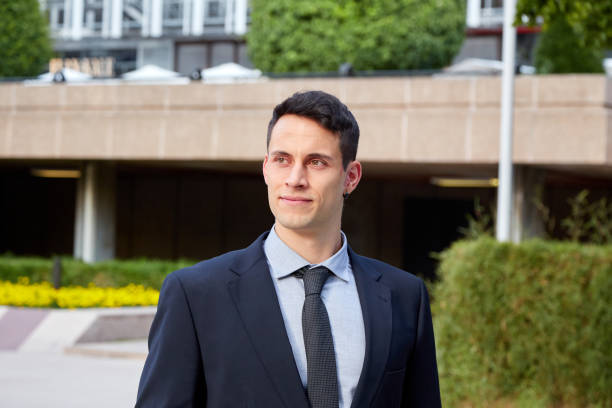 istock Young executive man waiting in a square 1303987208