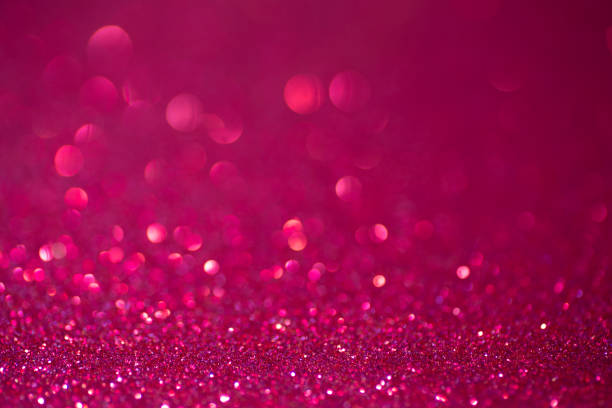 istock Glitter pink background.  Red and pink background with sparkling festive glitter 1303992877