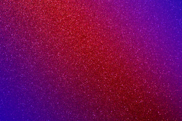 istock Glitter pink background.  Red and pink background with sparkling festive glitter 1303992900
