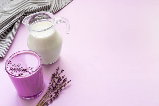 Purple lavender latte tea or coffee. Hot healthy drink stock photo