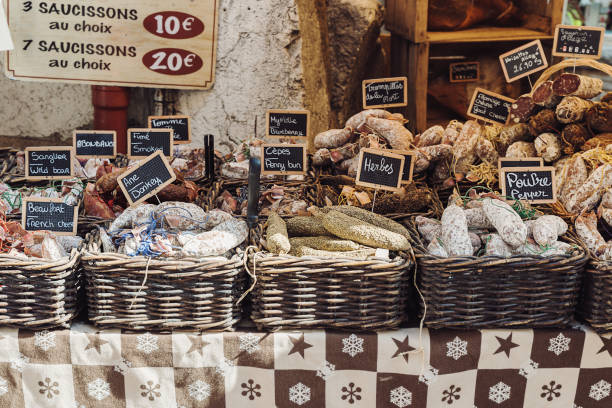 French open air market stand selling different kinds of salami - Annecy, Haute-Savoie French open air market stand selling different kinds of salami - Annecy, Haute-Savoie salumeria stock pictures, royalty-free photos & images