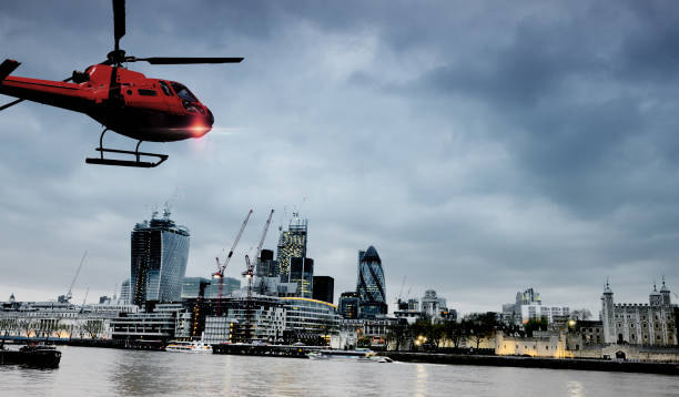 istock Helicopter Flying over Thames river, London, UK. 1303996754