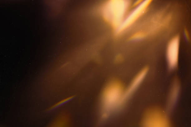 istock colorful warm rainbow light leaks on black background with dust texture 1303996900