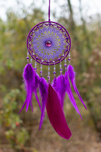 istock Handmade dream catcher with feathers threads and beads rope hanging 1303999828