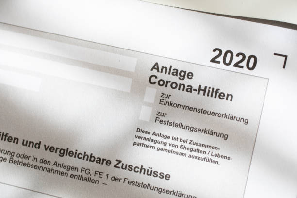 istock Request for emergency aid, close-up of a German application form/allowance for Corona emergency aid - Emergency aid Corona. 1303999908