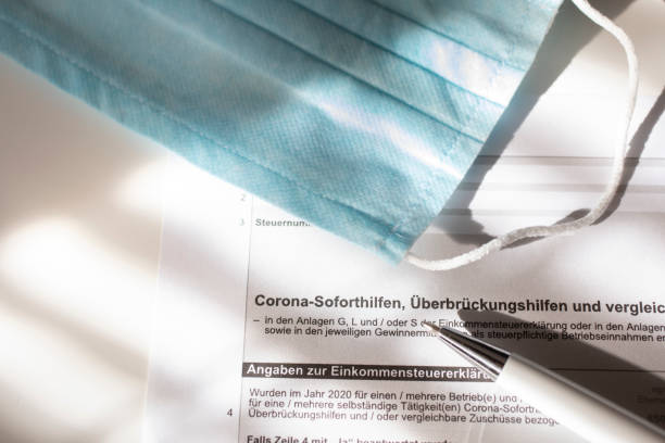 istock Request for emergency aid, close-up of a German application form/allowance for Corona emergency aid - Emergency aid Corona. 1303999914