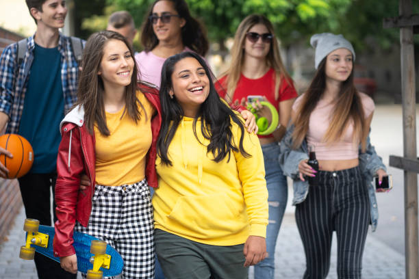 istock Girls and boys walking together 1304001329