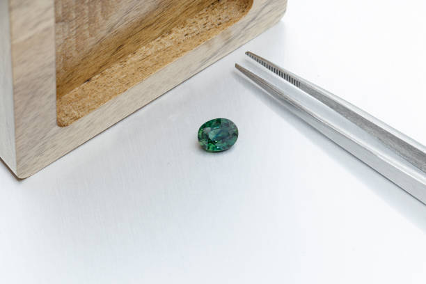 istock macro mineral faceted stone Sapphire on a gray background 1304001805