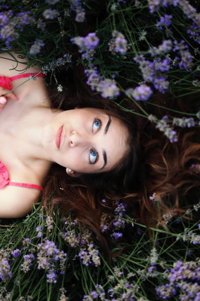 istock Girl laying in lavander field 1304003625