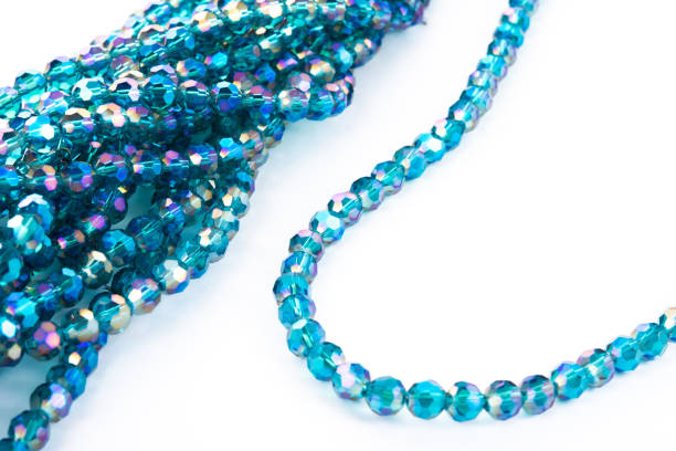 istock Beautiful emerald Glass Sparkle Crystal Isoalted Beads on white background. 1304004810