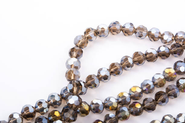 istock Beautiful Glass Sparkle Crystal Isoalted Beads on white background 1304005452