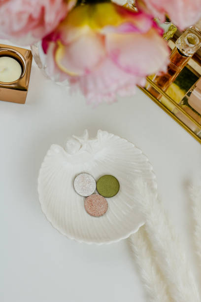 istock Makeup products on white plate and white background 1304005743