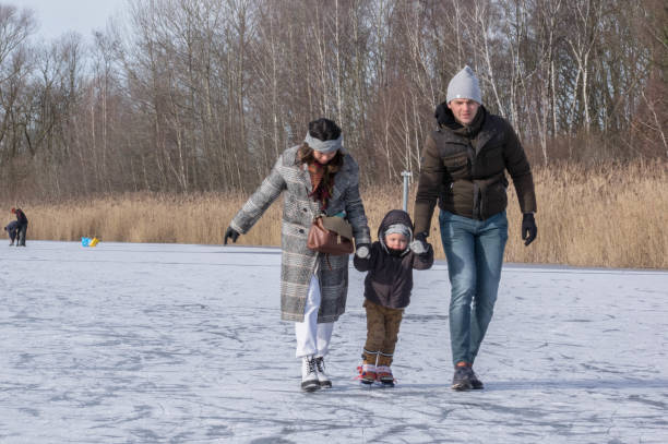 istock Family having iceskating fun 1304007258