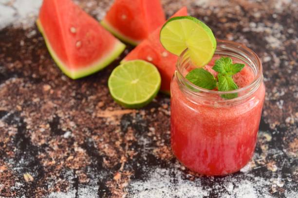 Refreshing summer drink watermelon, mint and lime. Refreshing summer drink watermelon, mint and lime. watermelon juice stock pictures, royalty-free photos & images