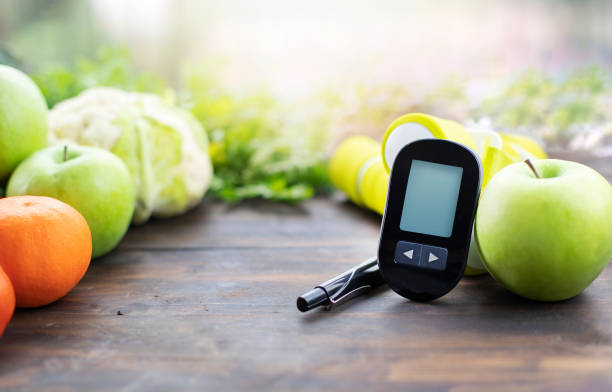 glucose meter and low glycemic food. - diabetes superfoods imagens e fotografias de stock