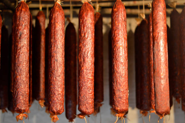 istock smoked pork sausages hanging on the pole 1304010983