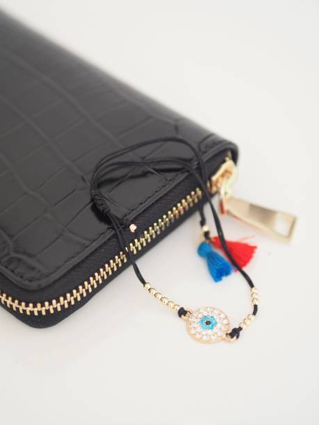 istock Evil eye bracelet for lucky charm and leather purse 1304011917