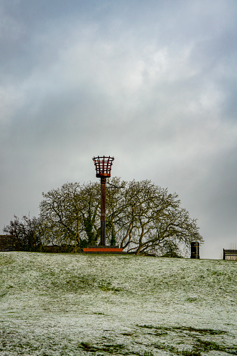 The beacon in the snow on Castle Hill, Huntingdon, UK.