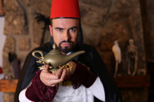 istock Arabic man holding gold lamp 1304012207
