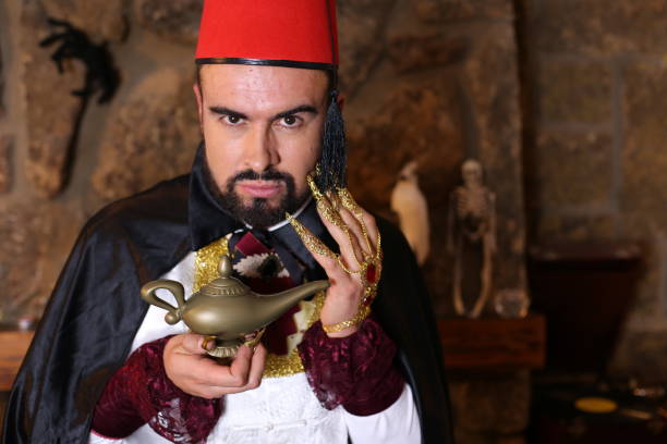 istock Arabic man holding gold lamp 1304012220