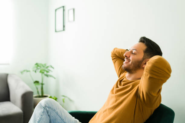 istock Latin man smiling while feeling calmed and relaxed 1304014315