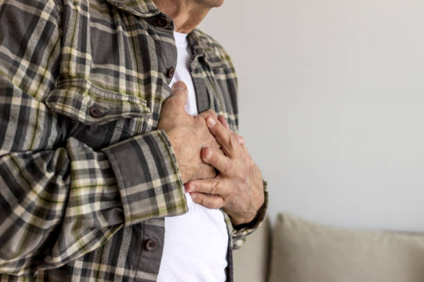 istock Senior man holding his chest in discomfort. 1304019648