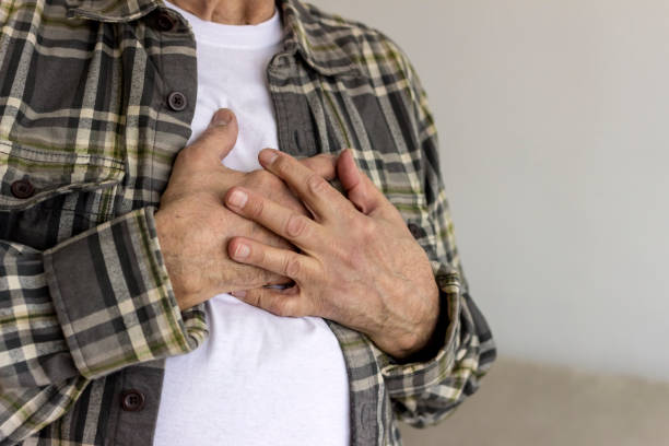 istock Elderly man with hand on chest suffering from chest pain. 1304019741
