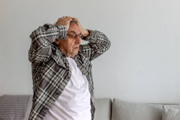 istock Senior man suffering with a migraine. 1304019764