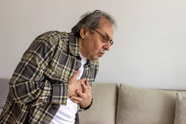 istock Elderly man with hand on chest suffering from chest pain. 1304019765
